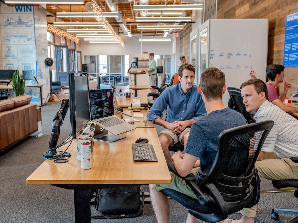 Business team collaborating at their shared workspace