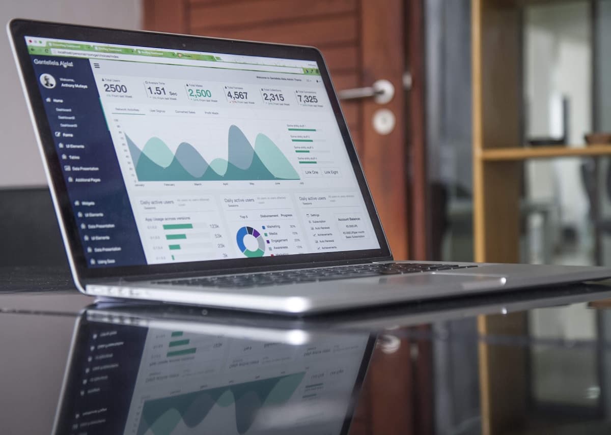 Laptop displaying website analytics and traffic charts